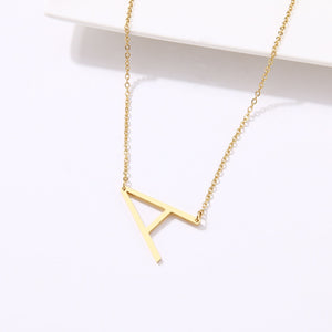 slanted initial necklace gold / a