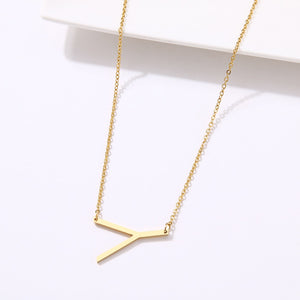 slanted initial necklace gold / y