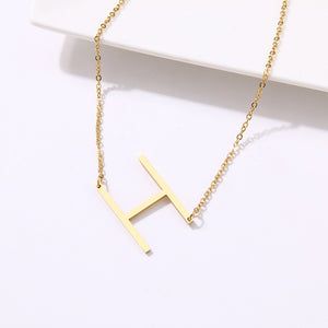 slanted initial necklace gold / h