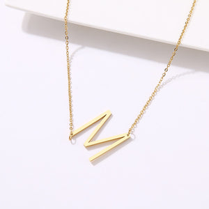 slanted initial necklace gold / m