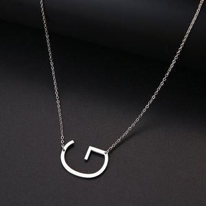 slanted initial necklace silver / g