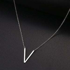 slanted initial necklace silver / v